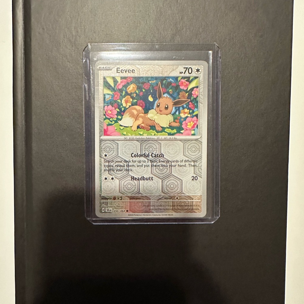 Eevee Collectible Card with Floral Background